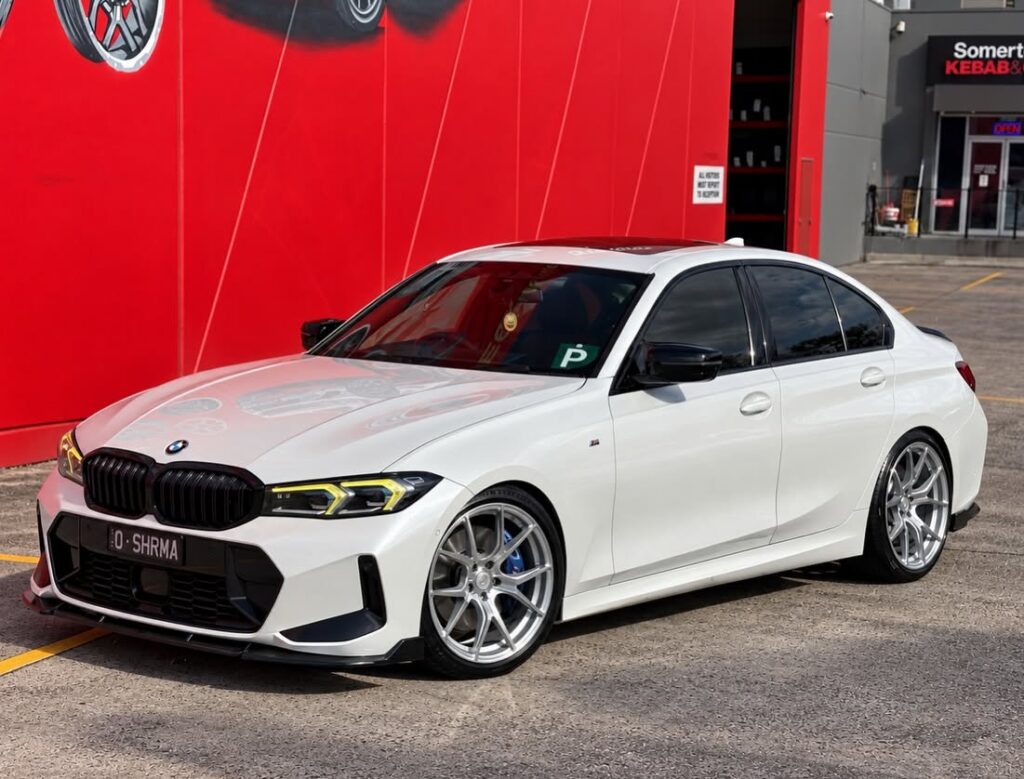 White BMW sedan with silver multi-spoke alloy wheels outside Tyreforce.