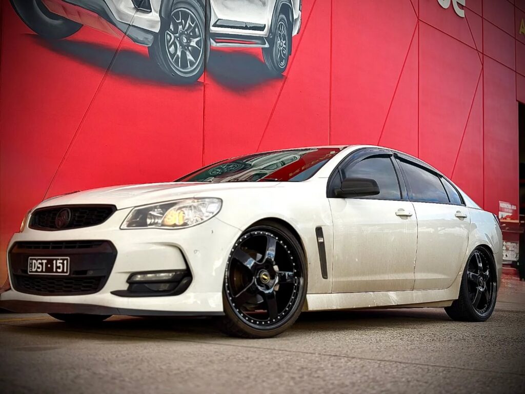 White Holden Commodore with Simmons FR1 gloss black alloy wheels outside Tyreforce.