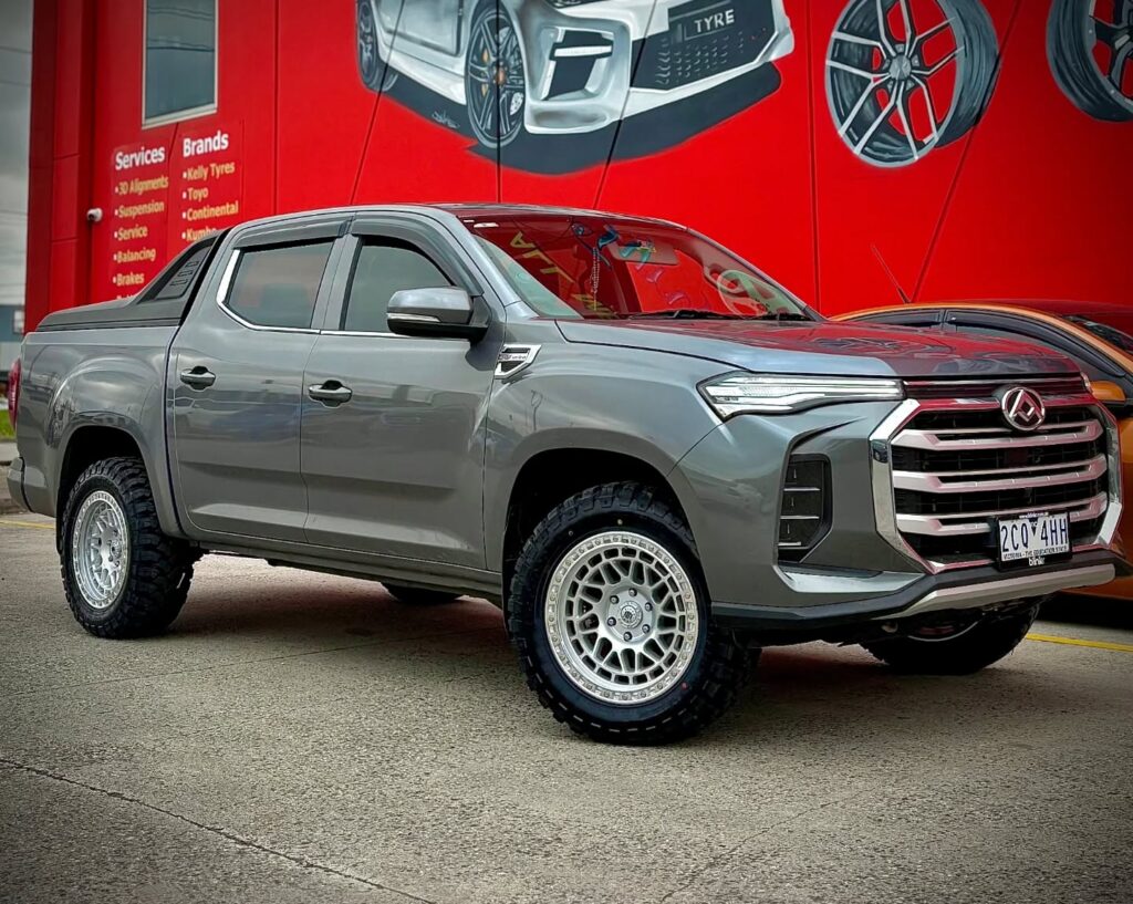 Grey LDV T60 ute with silver Black Rock Fury alloy wheels and off-road tyres outside Tyreforce.