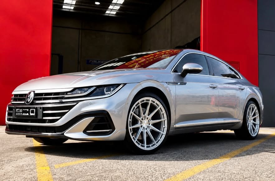 Silver Volkswagen Arteon with silver multi-spoke alloy wheels outside the Tyreforce workshop.